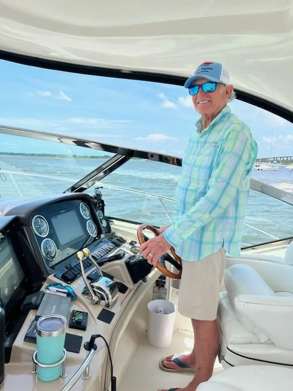 Captain Dan Stoll at the helm of a Charleston charter yacht