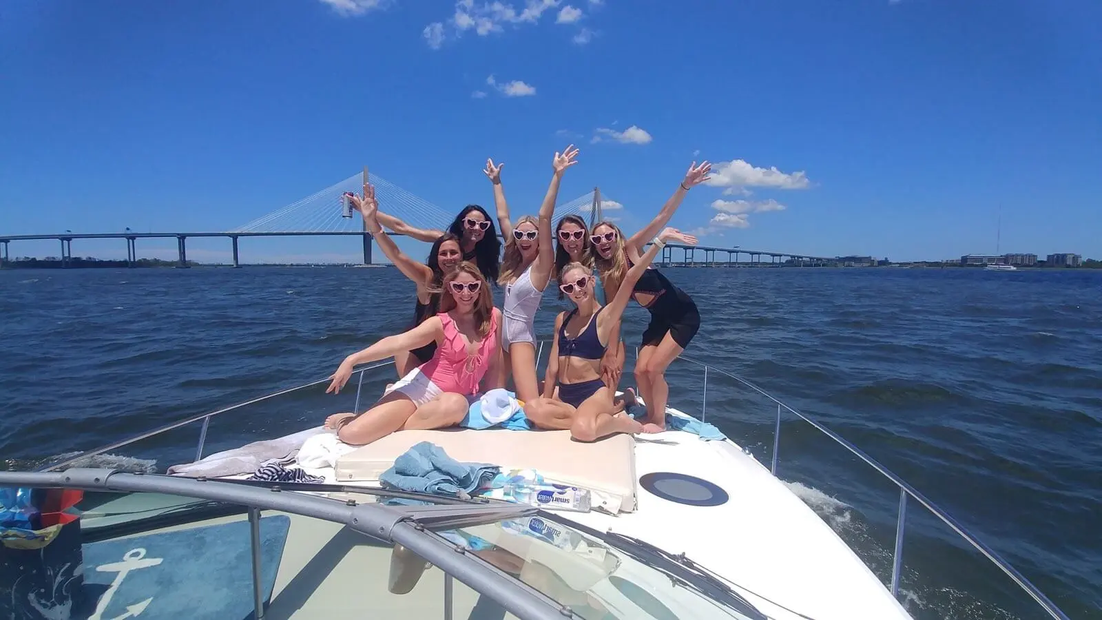Wagon Wheel charter boat crossing Charleston harbor with the Ravenel Bridge behind it